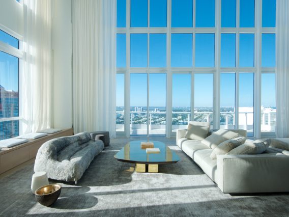 Continuum PH Miami residence living room sofas with city view through floor-to-ceiling windows