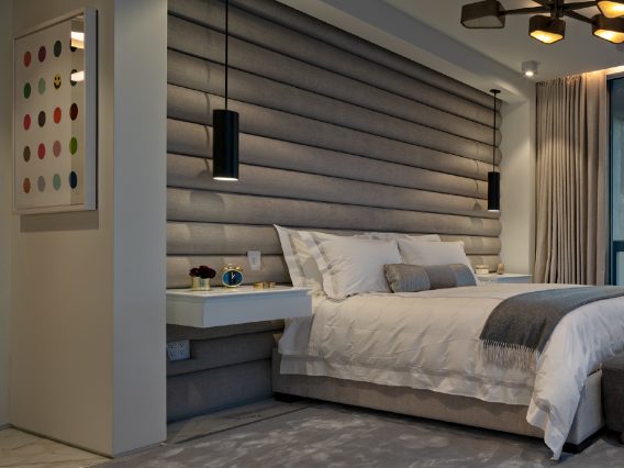Carillon Miami residence bedroom and wall-sized headboard