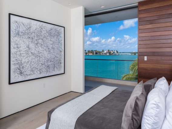 Hibiscus Island Miami residence bedroom with view of the water